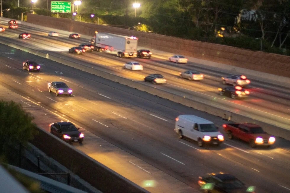 cars on highway at night