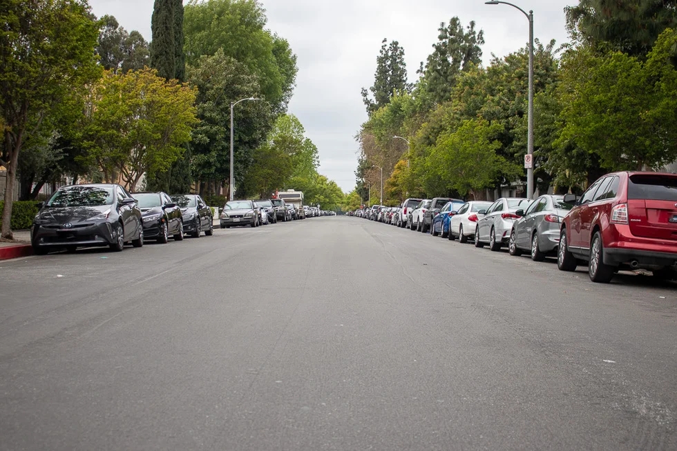 cars parked on side of road