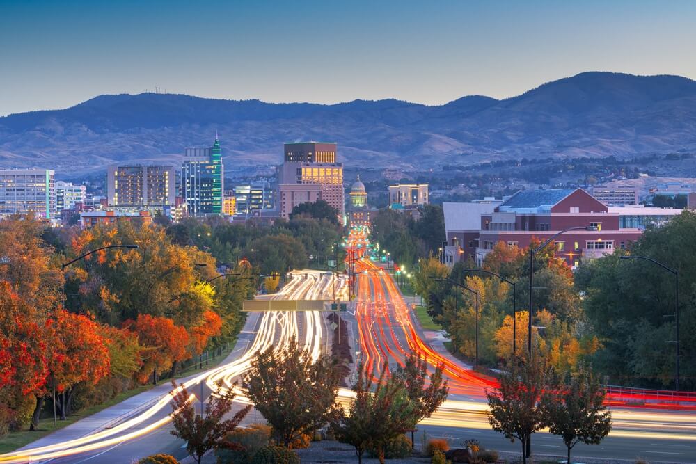 Boise Idaho city skyline with evening traffic, illustrating local driving conditions and crash rate comparisons in Boise, Meridian, and Nampa.