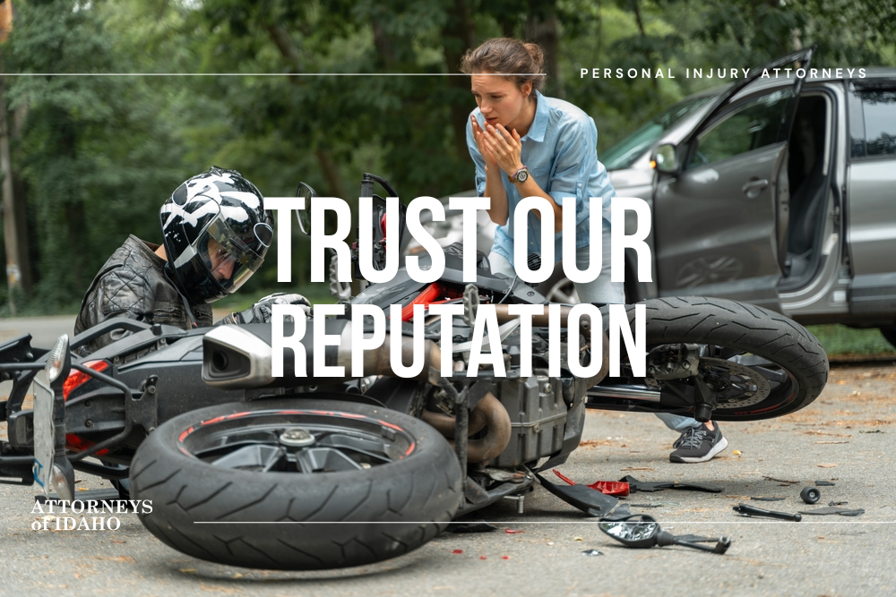 Injured rider near damaged bike and car showing risks of motorcycle accidents in Boise